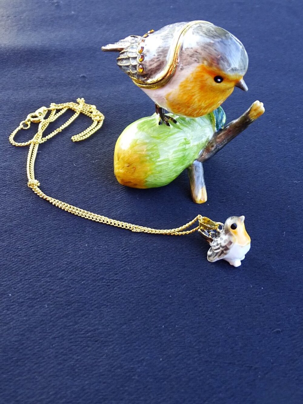 Metal Bird Trinket Box holding a Baby Bird Necklace